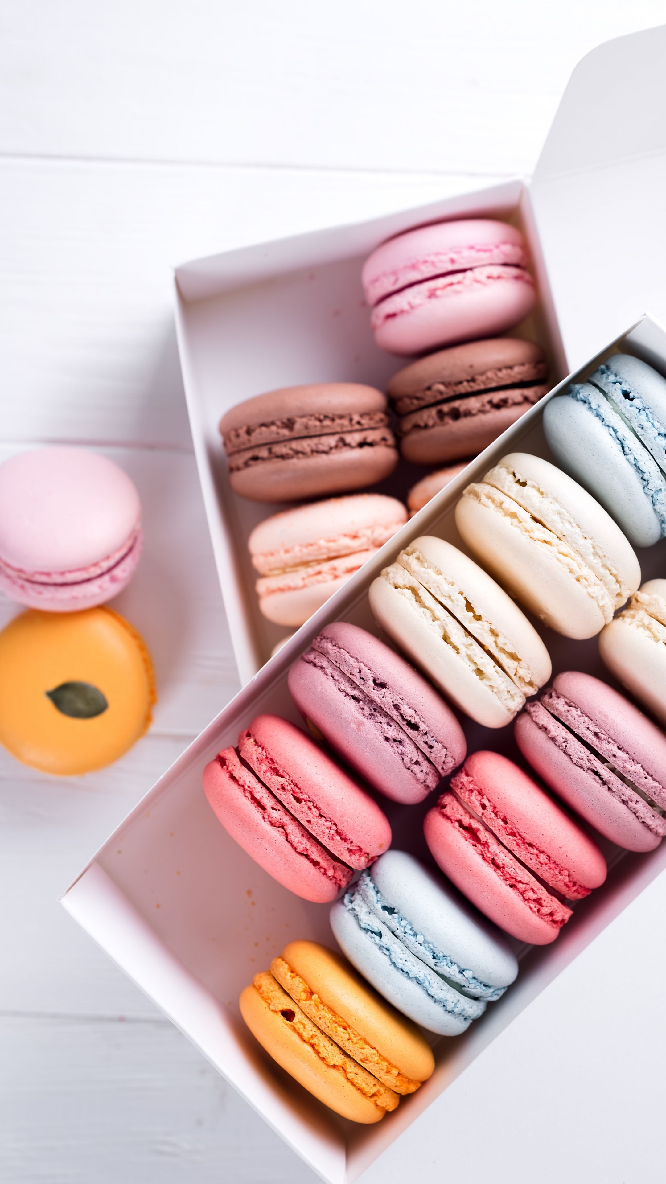 A box of macarons with different colors - Macarons