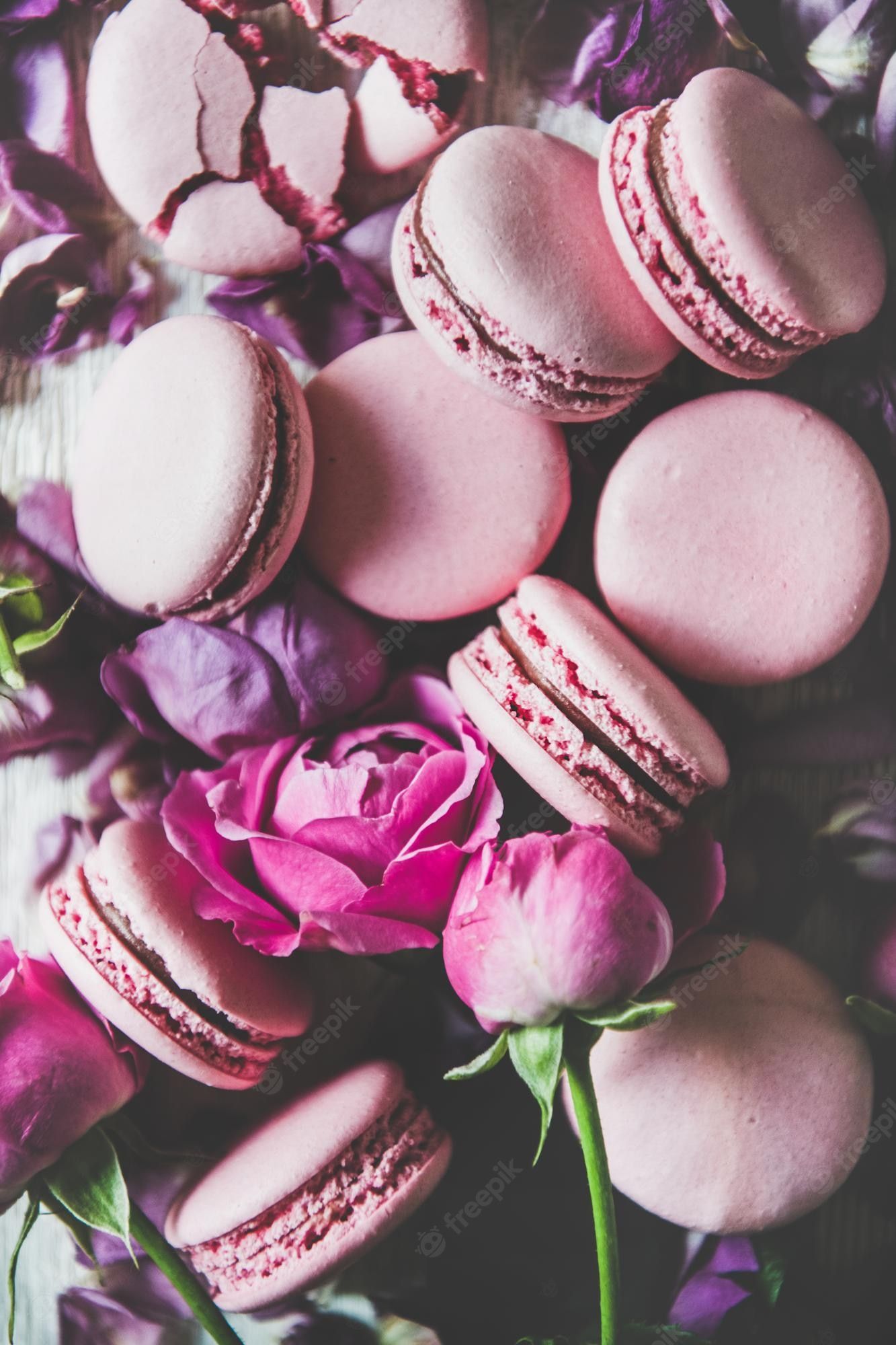 Pink macarons and roses on a table - Macarons