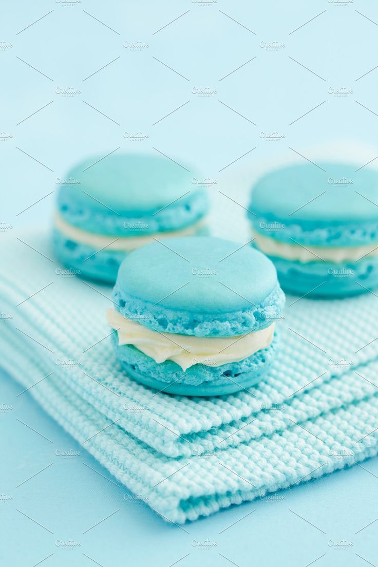 Macarons with white chocolate cream on a blue background - Macarons