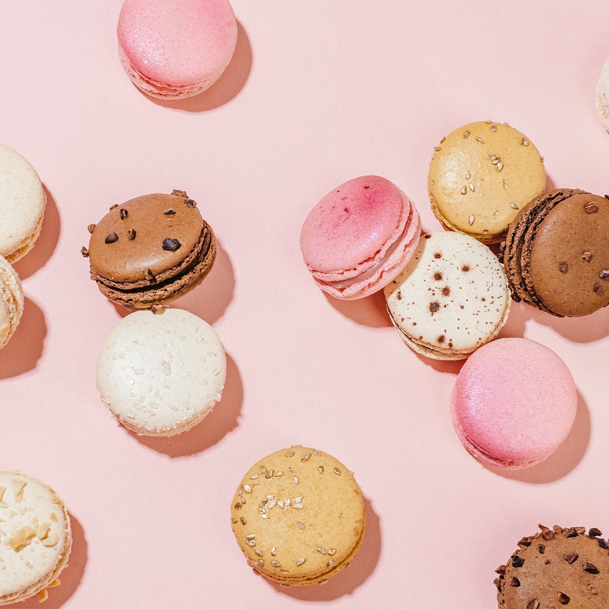 A close up of some macaroons on pink - Macarons