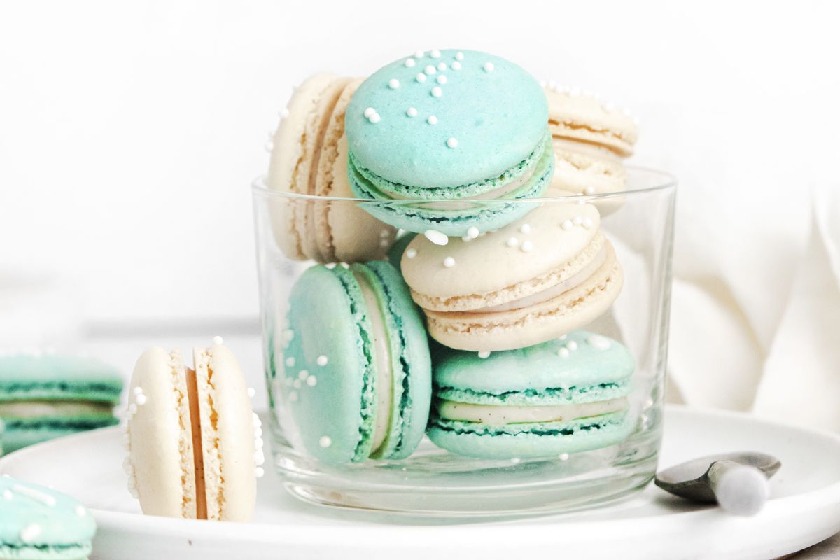 A glass with some macaroons in it - Macarons