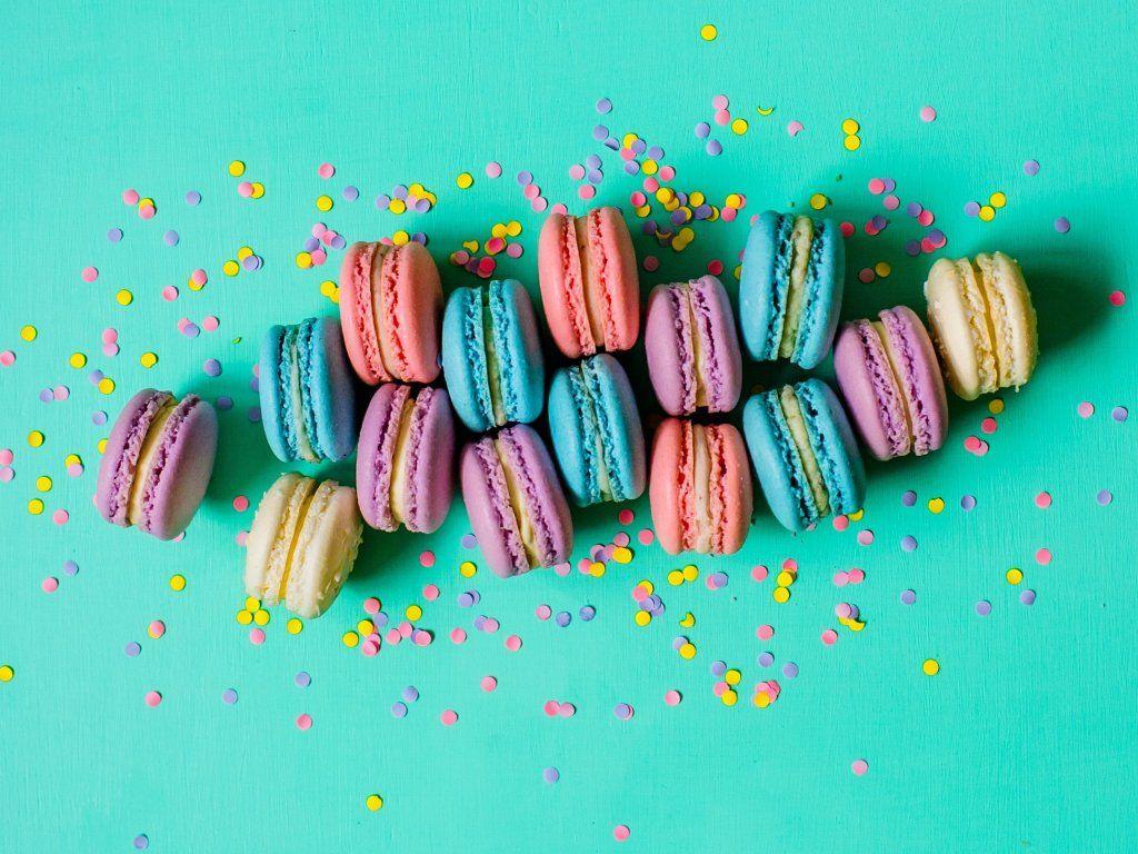 Colorful macarons on a green background - Macarons