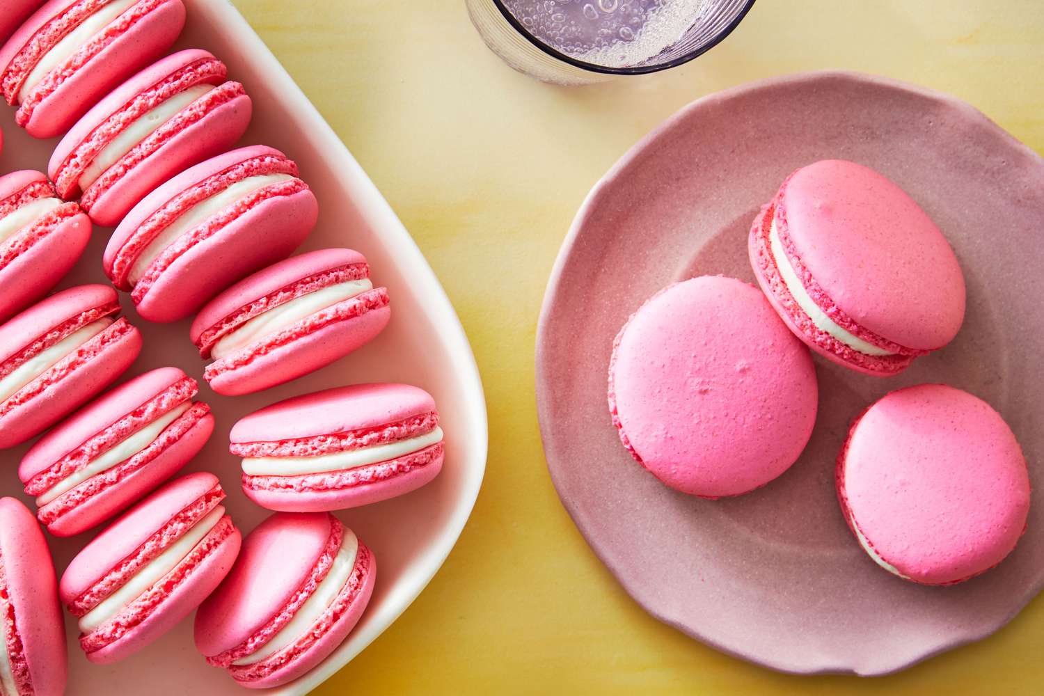 Pink macarons on a plate and in a bowl - Macarons