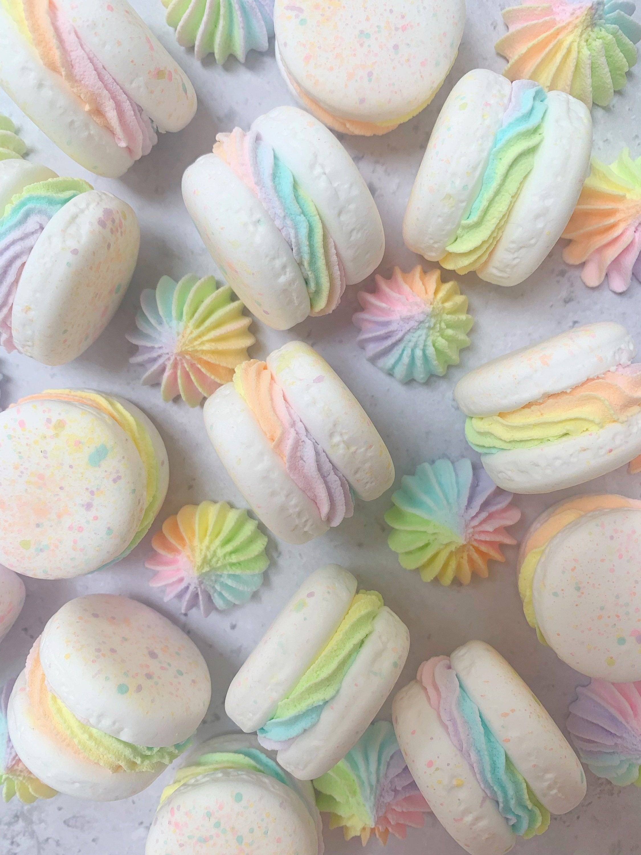 A tray of macarons with rainbow sprinkles - Pastel rainbow, macarons