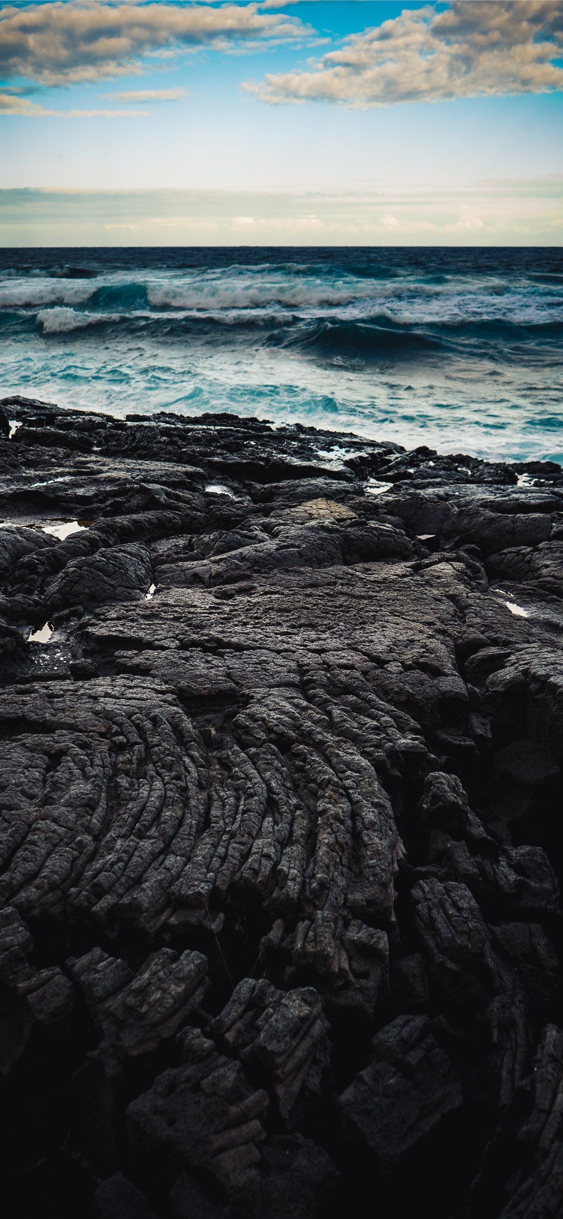 A person is standing on the beach - Coast