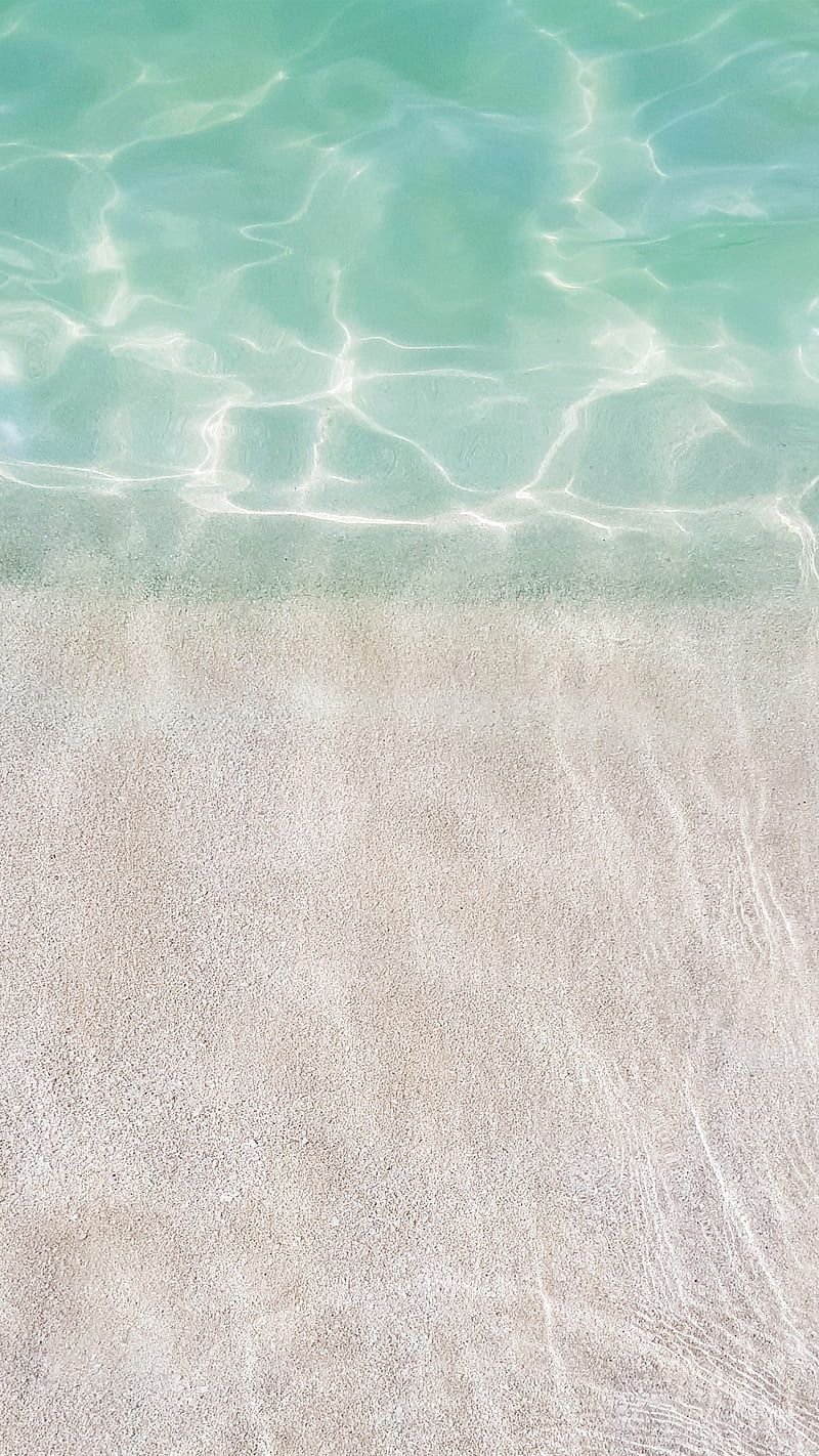 A photo of the ocean with a sandy bottom - Coast