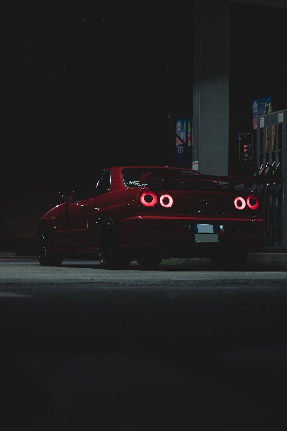 Red sports car at the gas station - Nissan Skyline