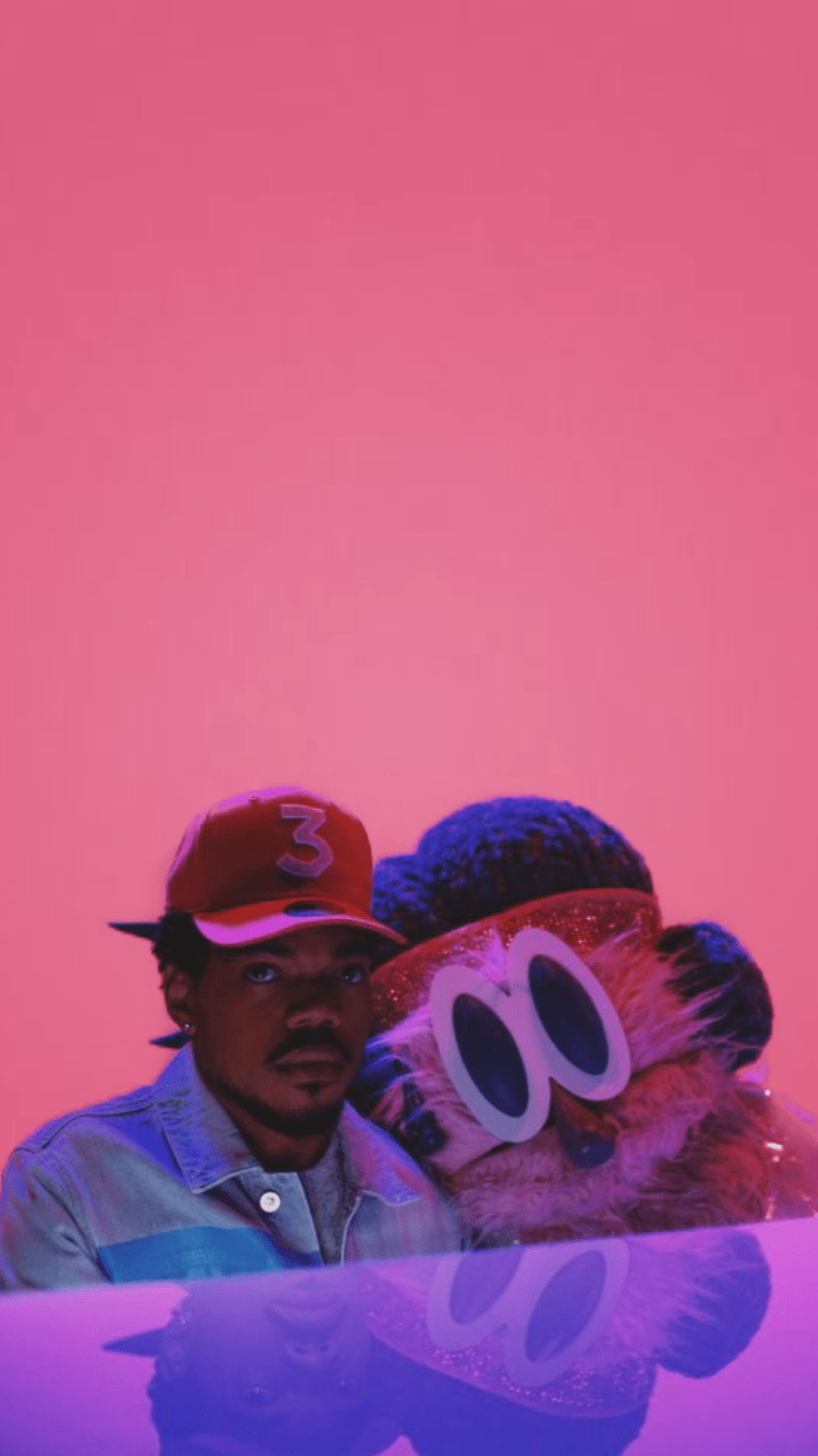 A man in red hat and blue shirt with an owl - Chance the Rapper