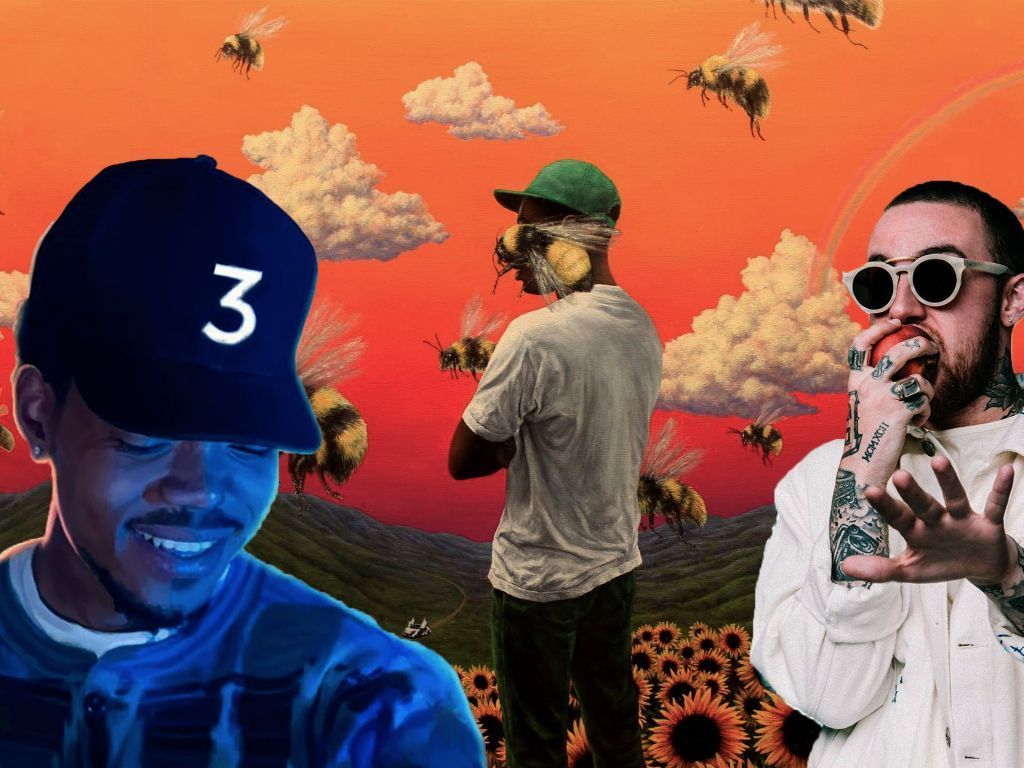 A man in sunglasses and hat is standing next to two other men - Chance the Rapper