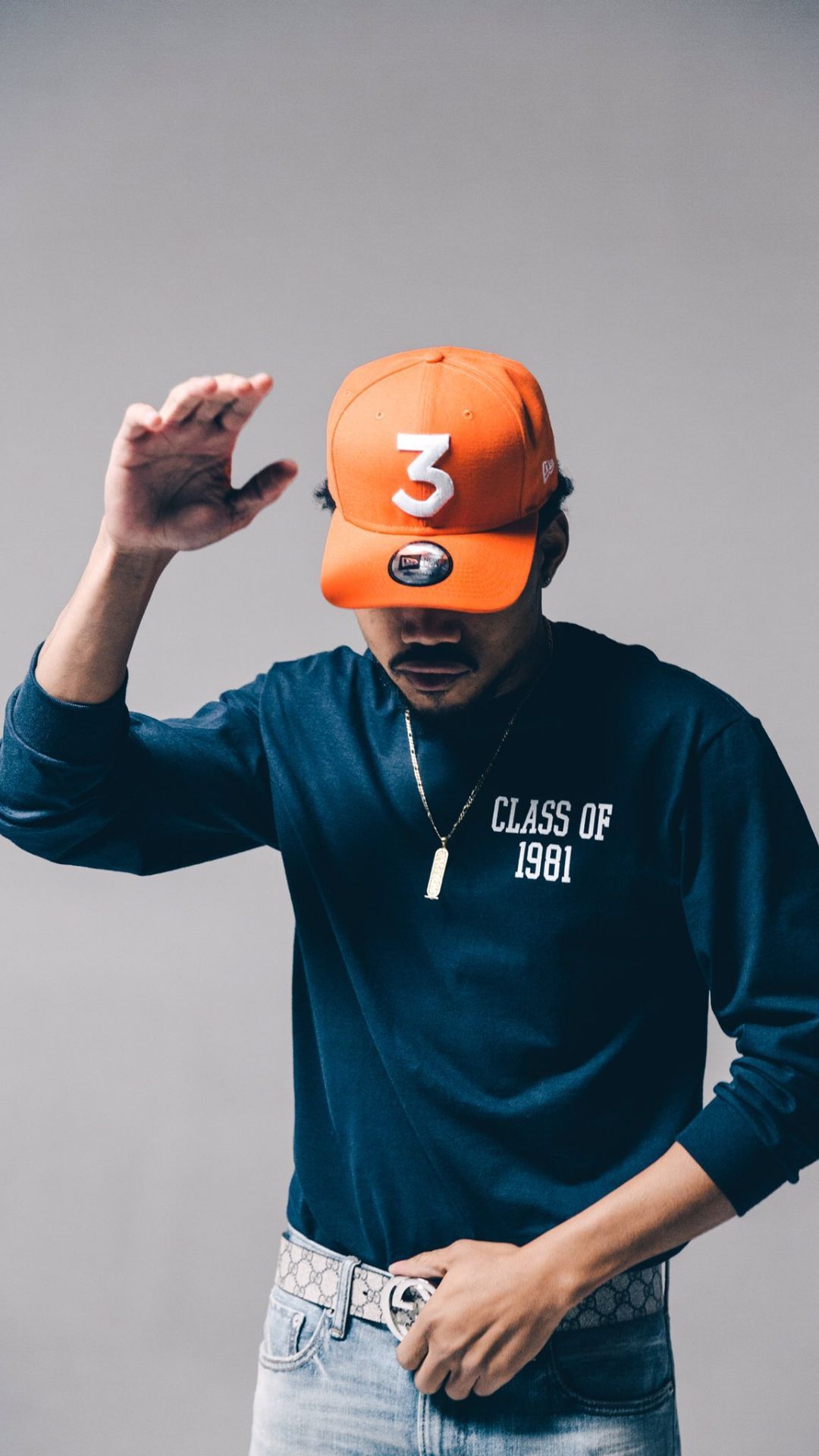 A man in an orange cap and blue shirt - Chance the Rapper