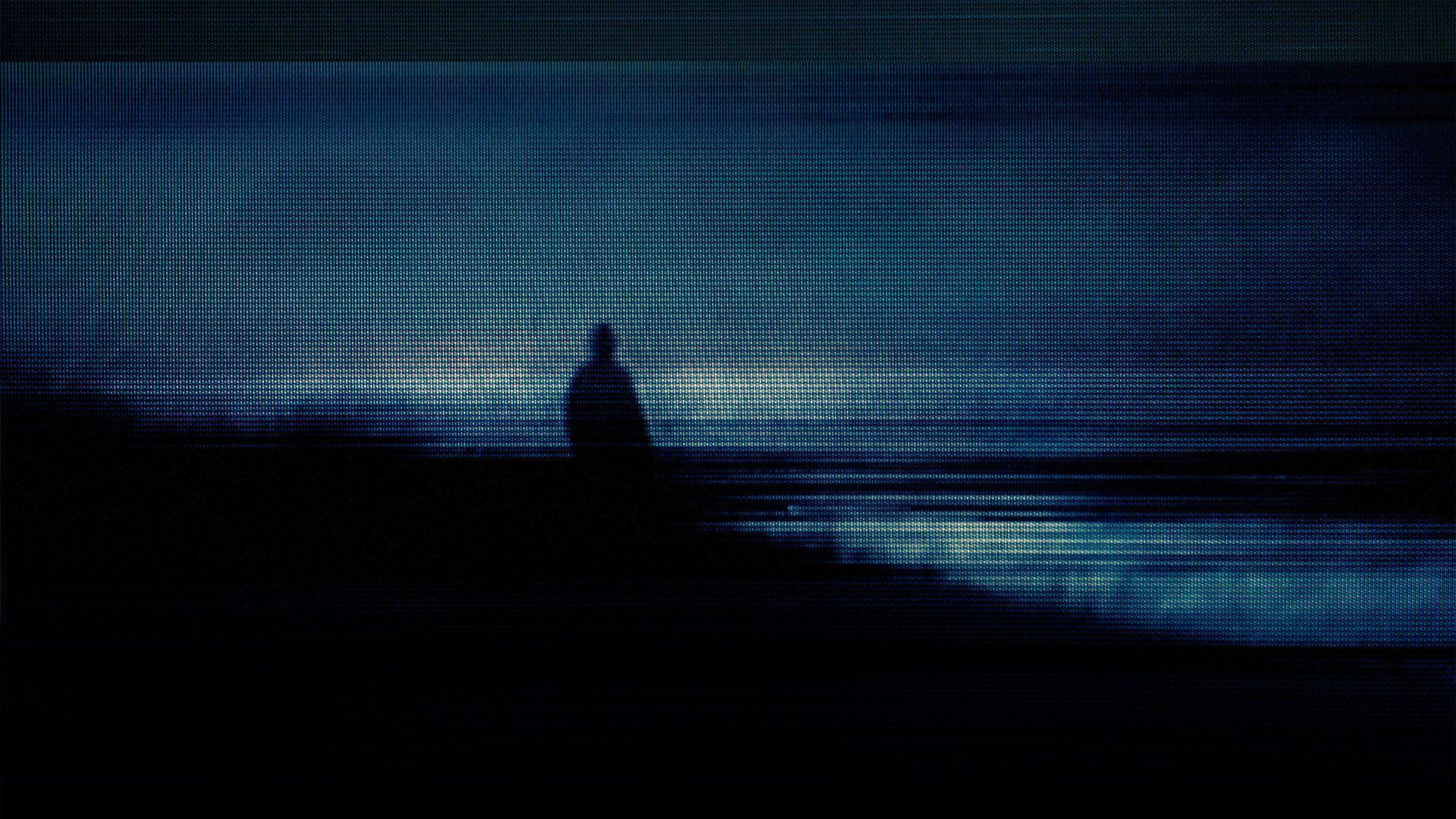 A person standing on the beach at night - Dark vaporwave