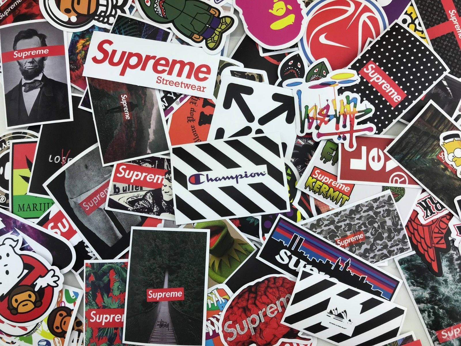 A pile of Supreme stickers on a white background - Supreme