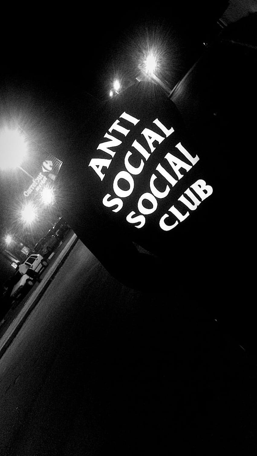 A black Anti Social Social Club shirt on a mannequin in a dark room with bright lights - Anti Social Social Club