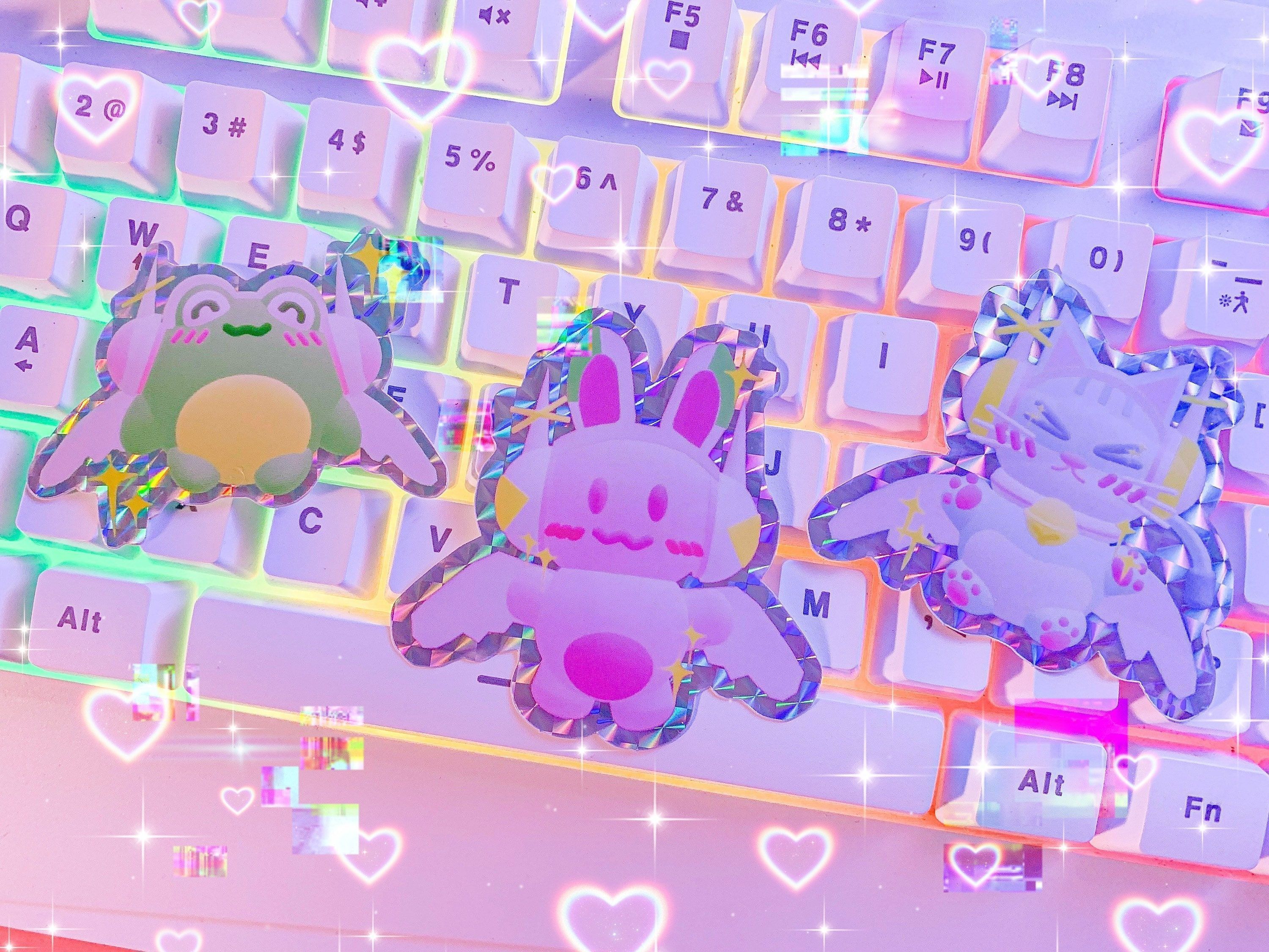 Acrylic keychains of a frog, a bunny, and a cat sitting on a keyboard. - Webcore, animecore, Internetcore