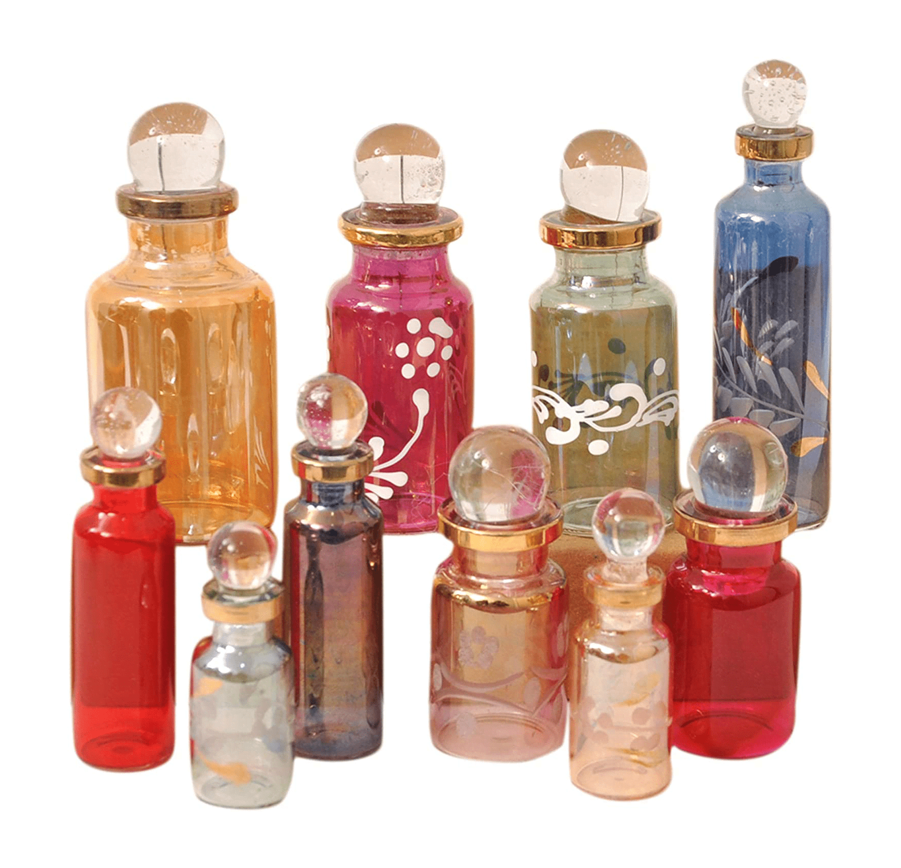 A group of small glass bottles with different colors - Witchcore