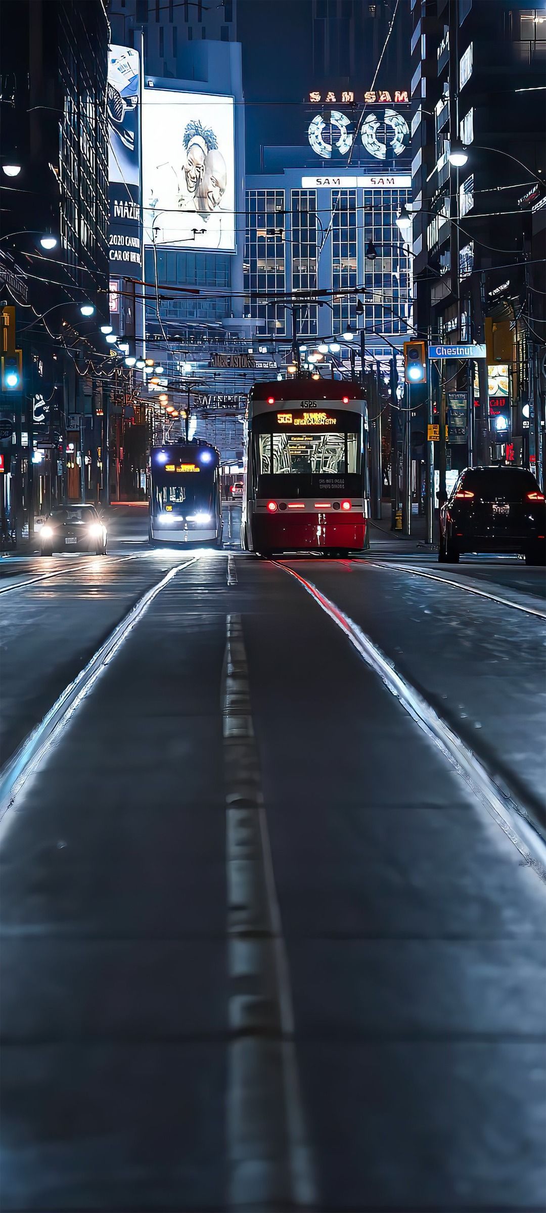 A city street with traffic and lights - 1080x2400