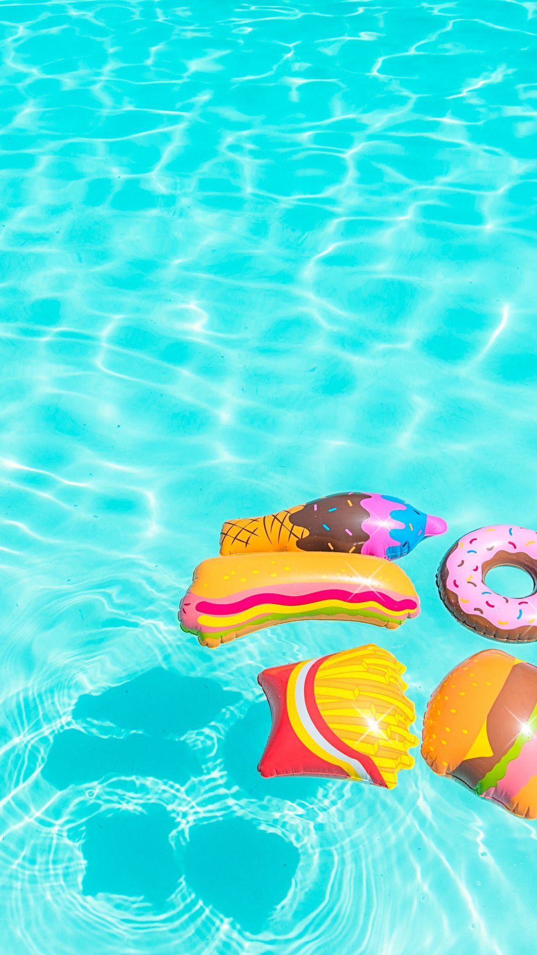 IPhone wallpaper with a pool and inflatable food. - Swimming pool, summer, bright