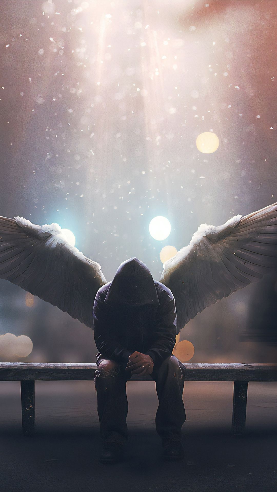 A person sitting on the bench with wings - Wings
