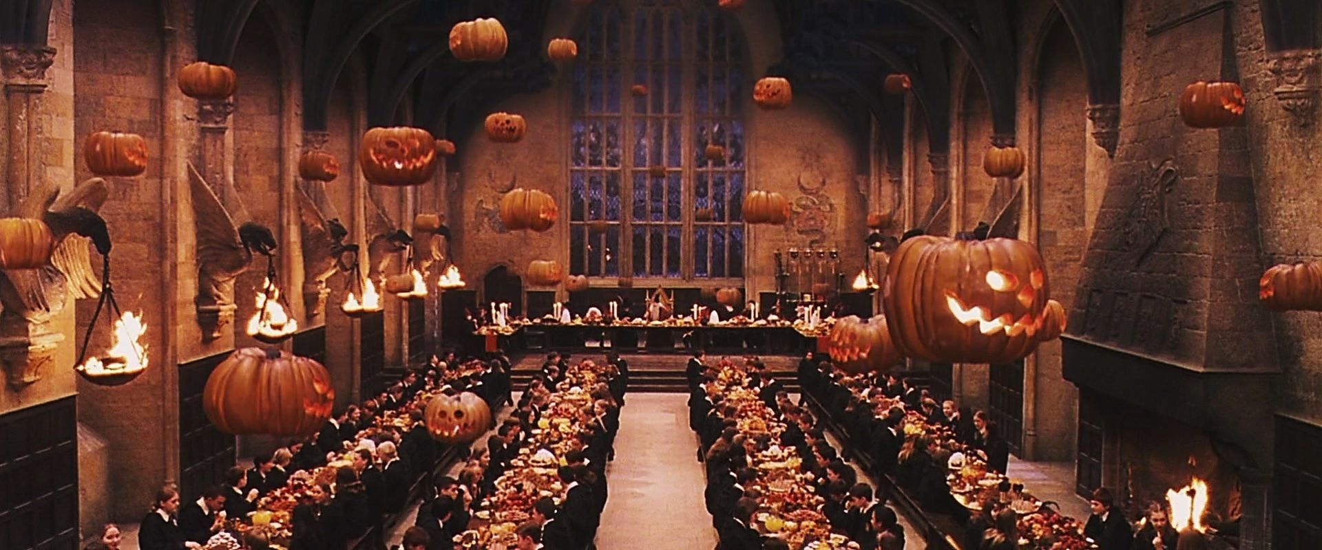 The Great Hall is decorated with jack-o'-lanterns and torches for the Halloween feast. - Halloween desktop