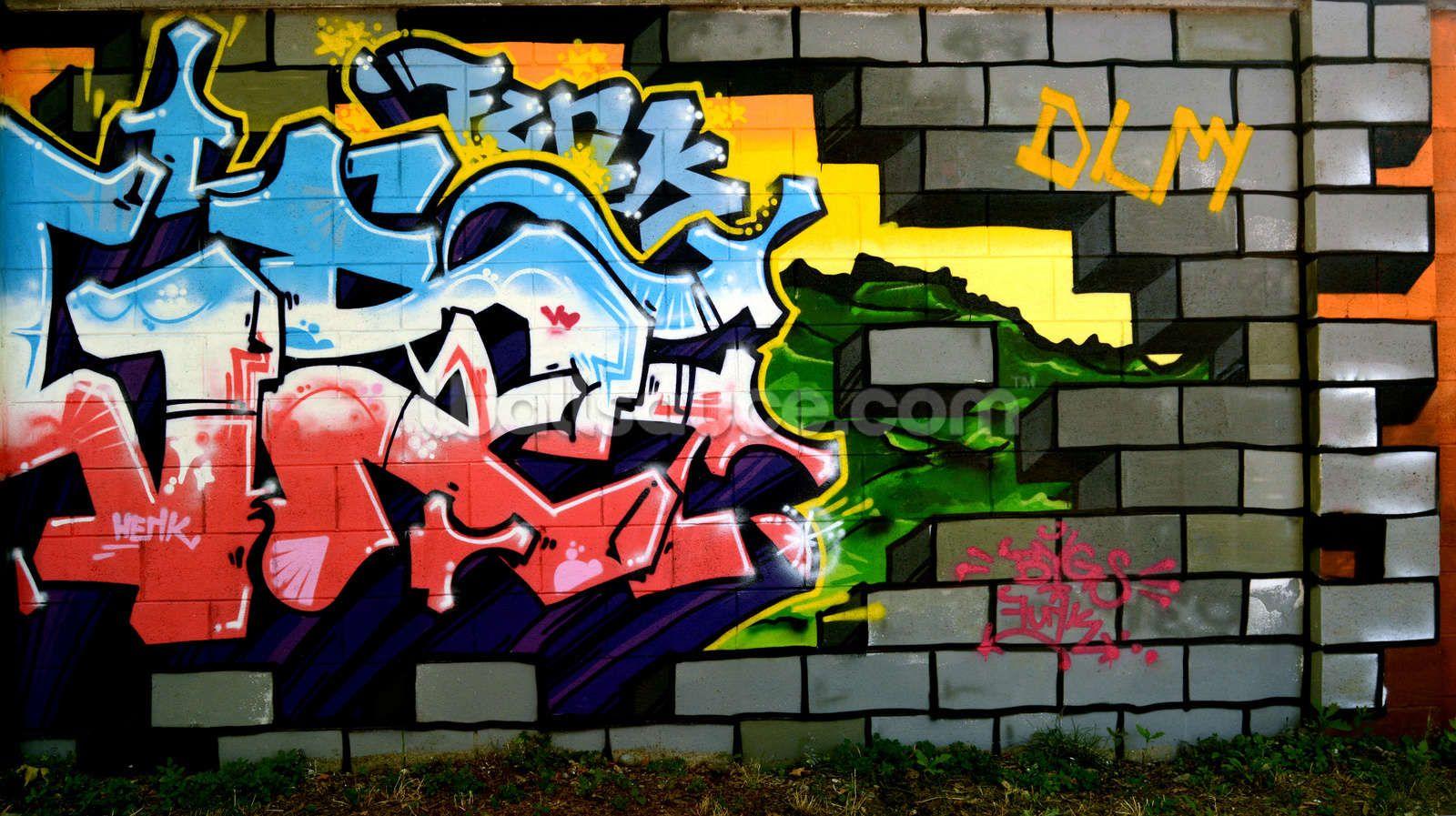 A colorful graffiti wall with some writing on it - Street art