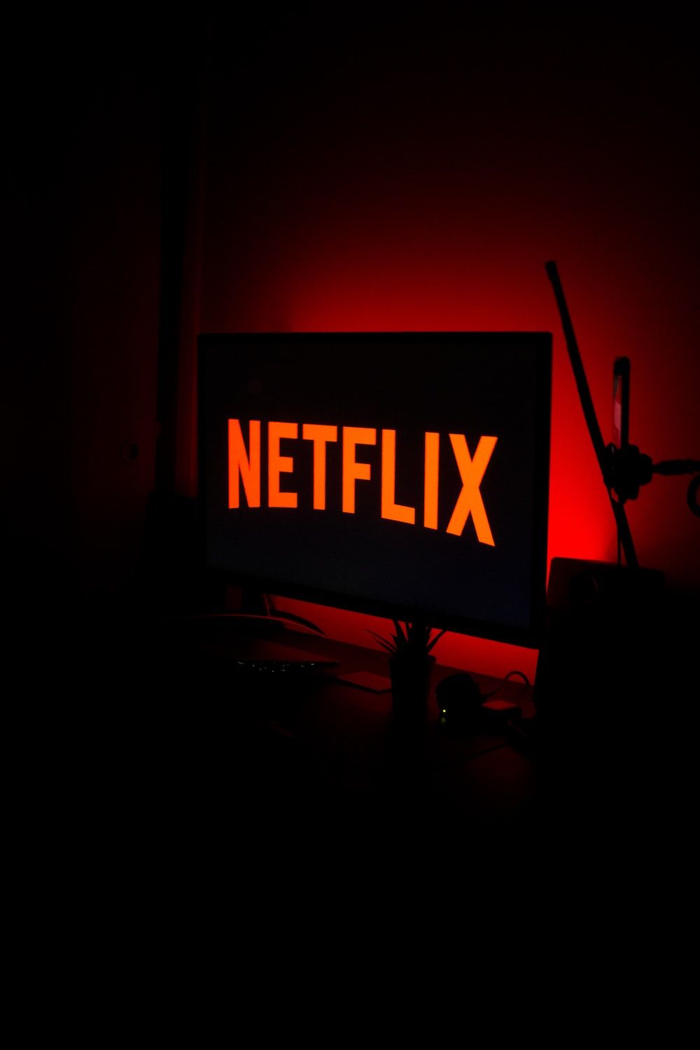 A red netflix sign sitting on top of a desk photo