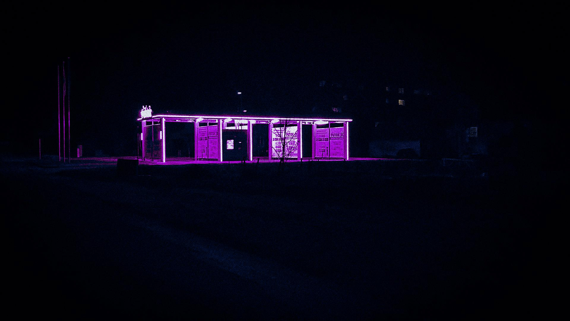 A purple lit up building in the night - Dark vaporwave