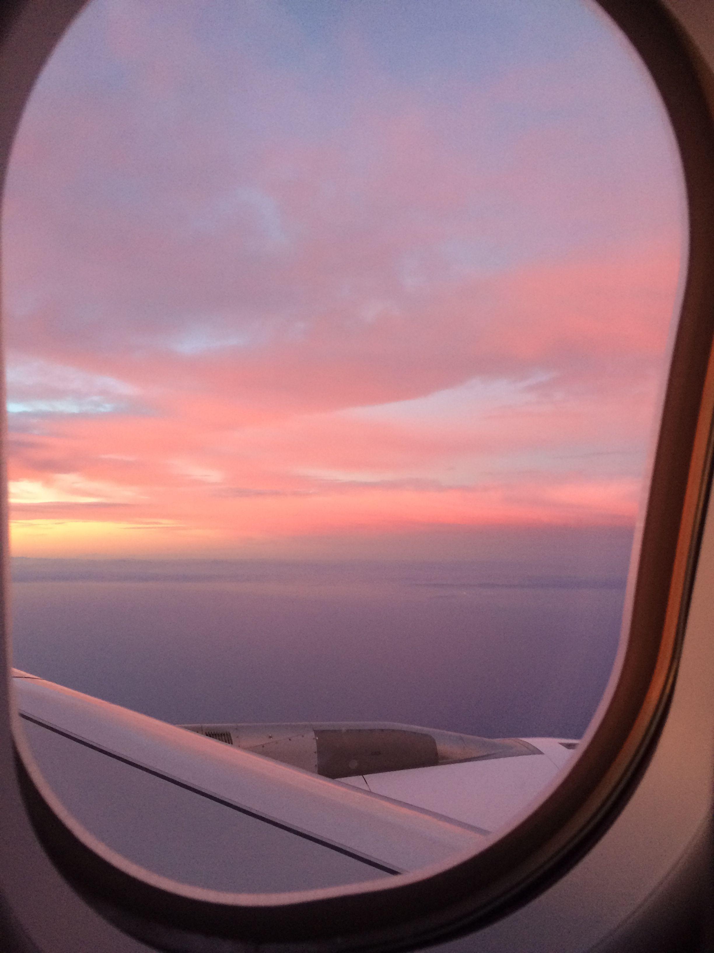 A sunset view from a plane window - Airplane