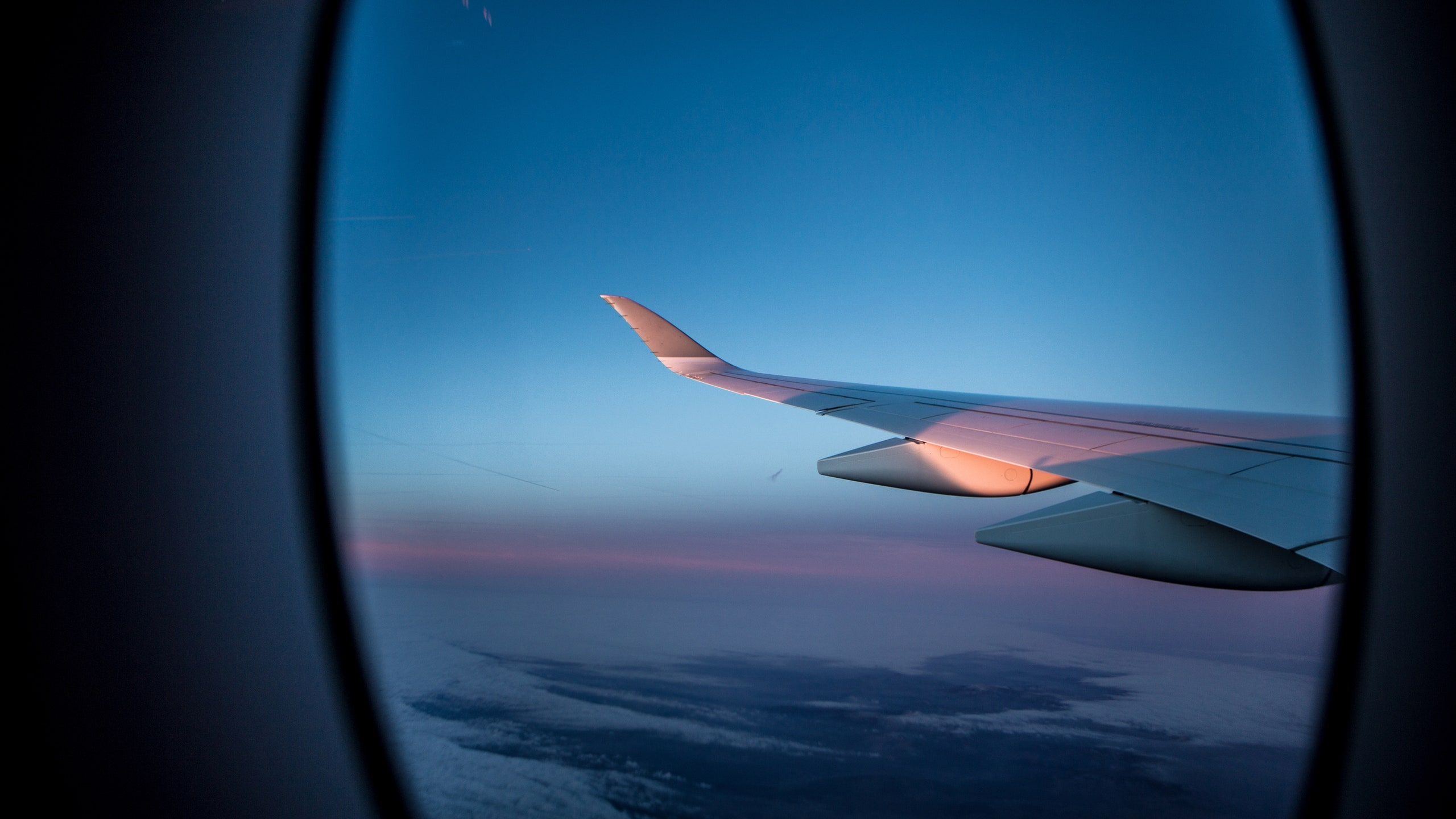 A view of an airplane wing from the window - Airplane