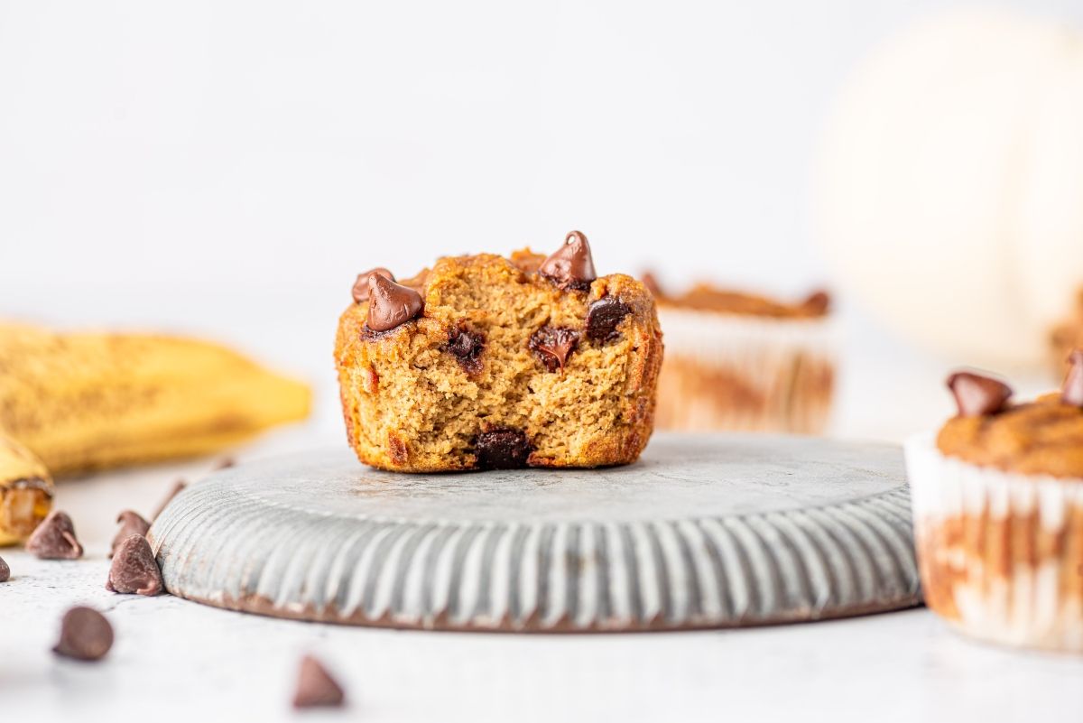 A muffin is sitting on top of the counter - 