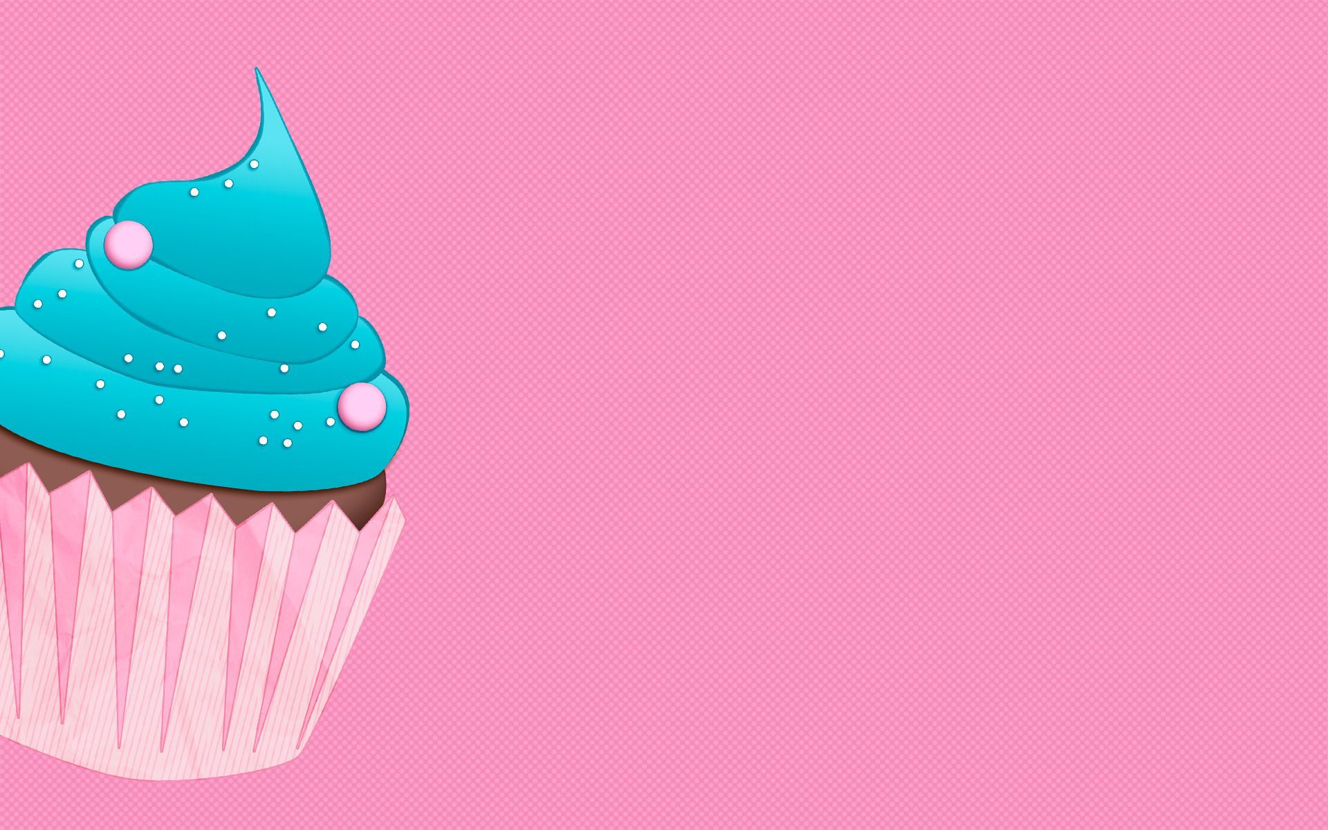 A pink cupcake with blue frosting on a pink background - 