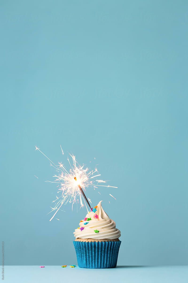 Birthday cupcake with a sparkler by Robert Witty for Stocksy United - 