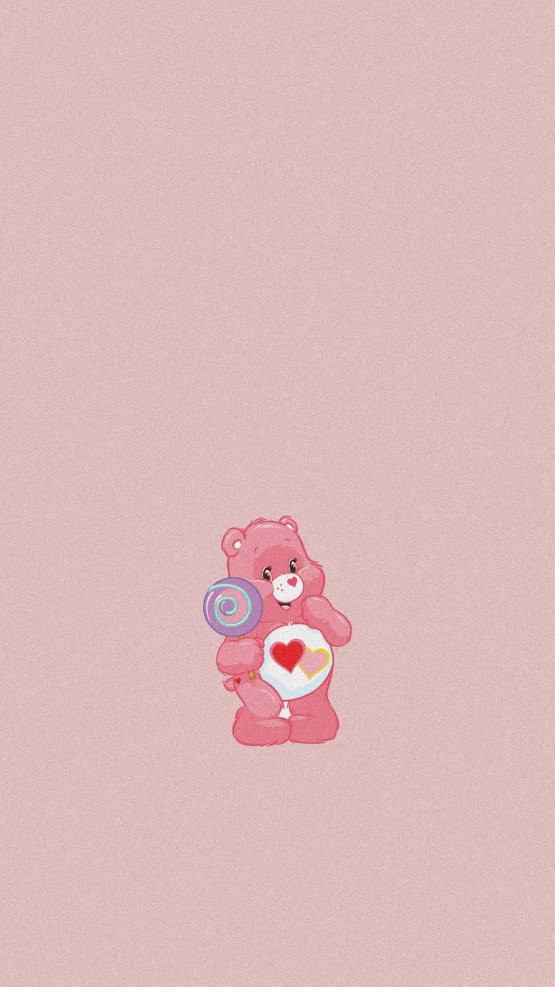 Pink bear holding a lollipop - Care Bears