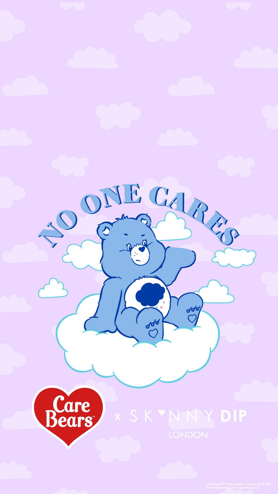 A blue teddy bear sitting on top of clouds - Care Bears