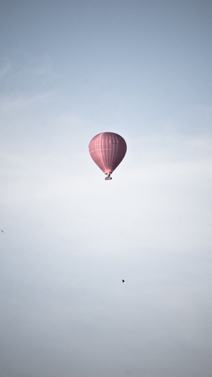 A hot air balloon flying in the sky - Balloons