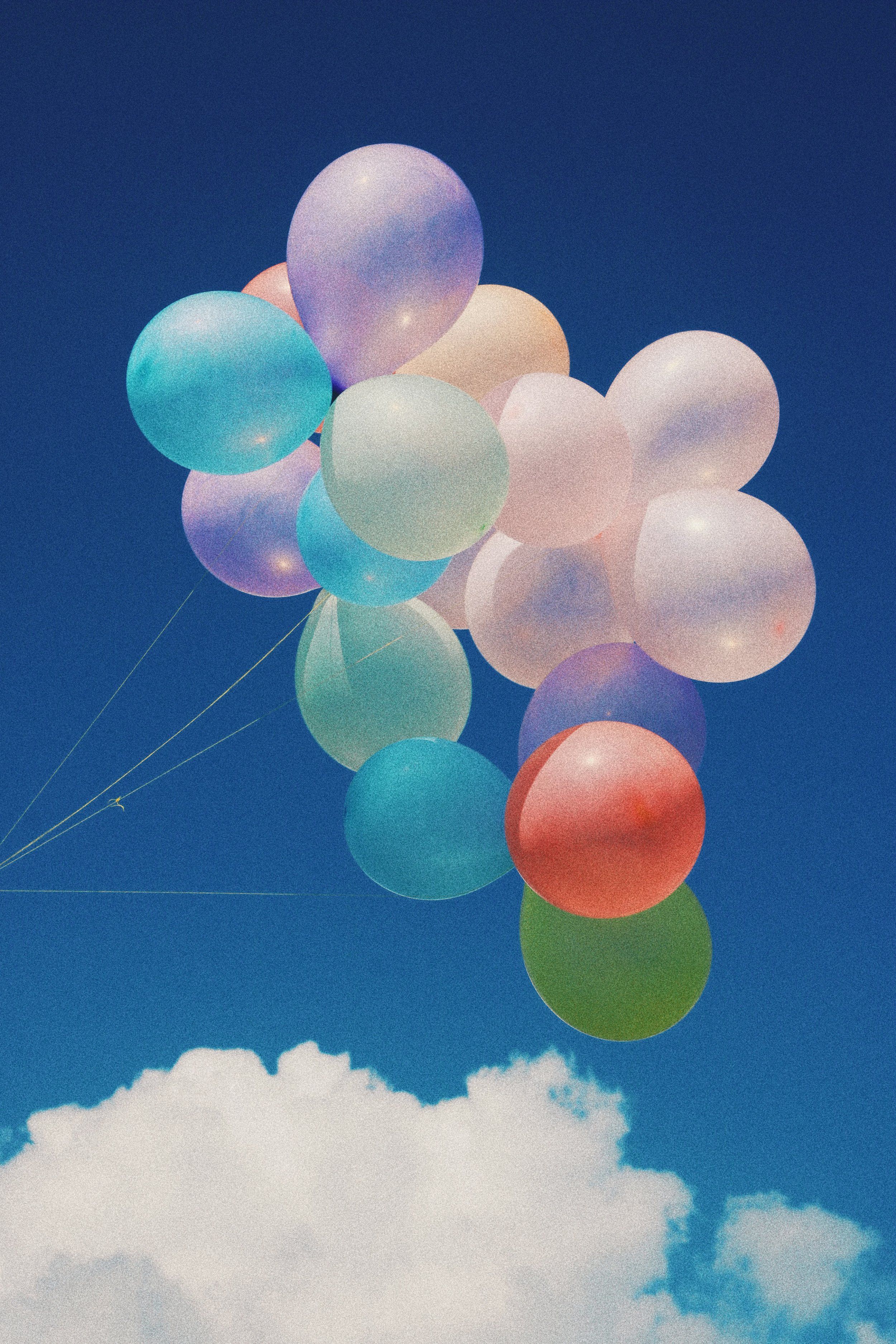 A person flying kites with balloons in the sky - Balloons