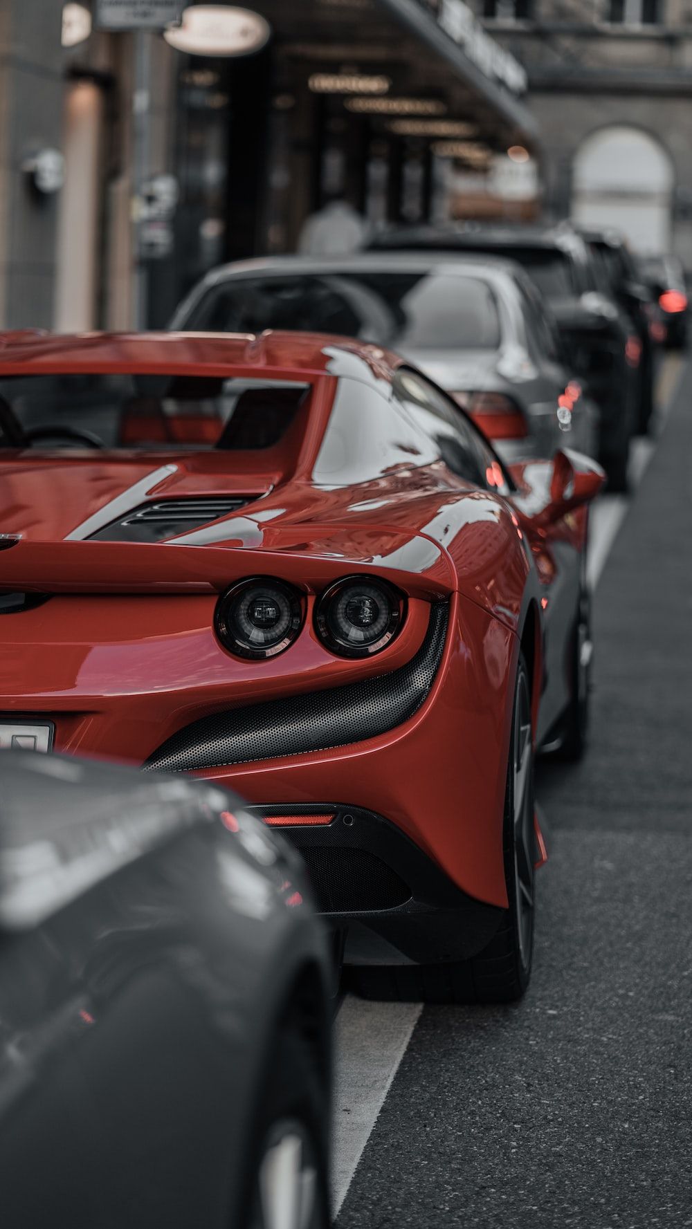 A row of parked cars on a city street photo