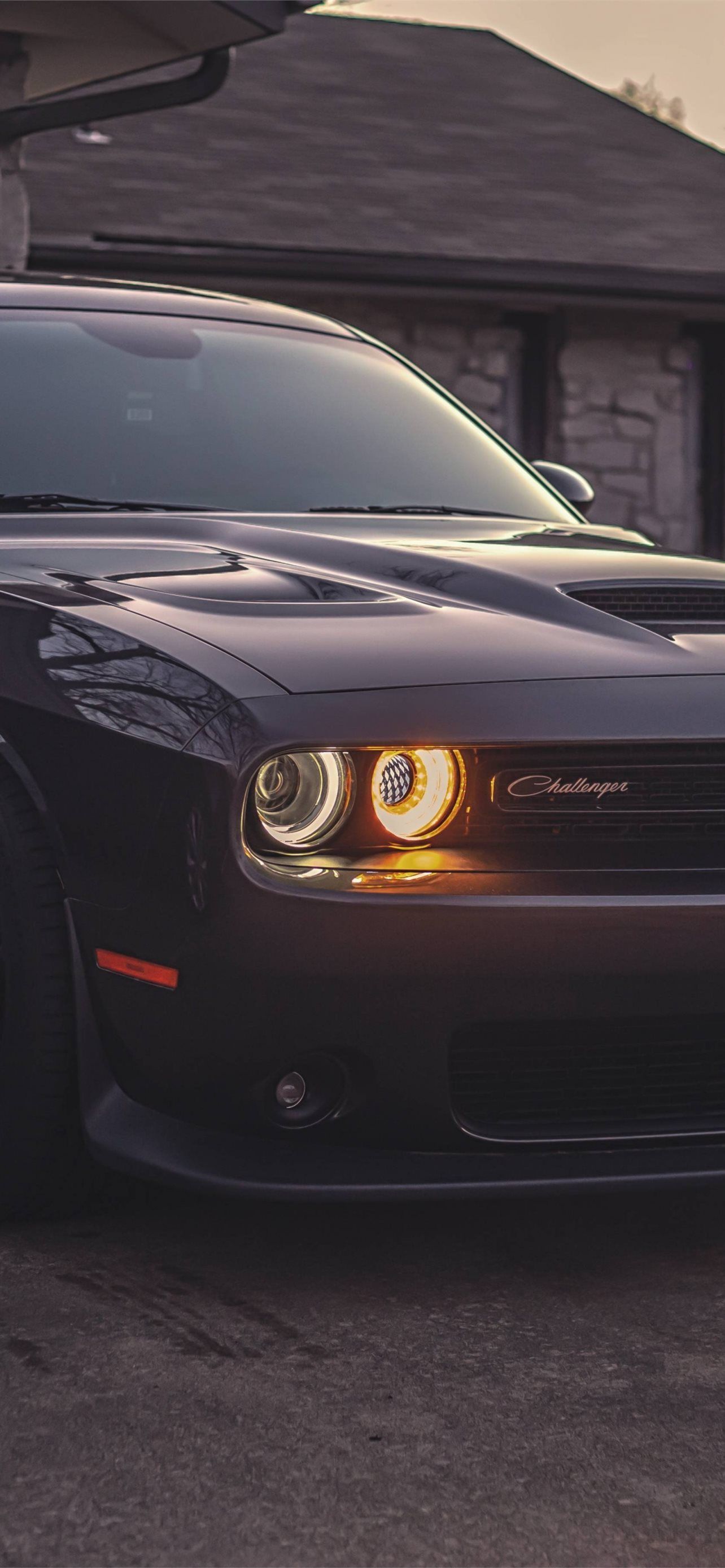 A black dodge Challenger in front of a house - Cars
