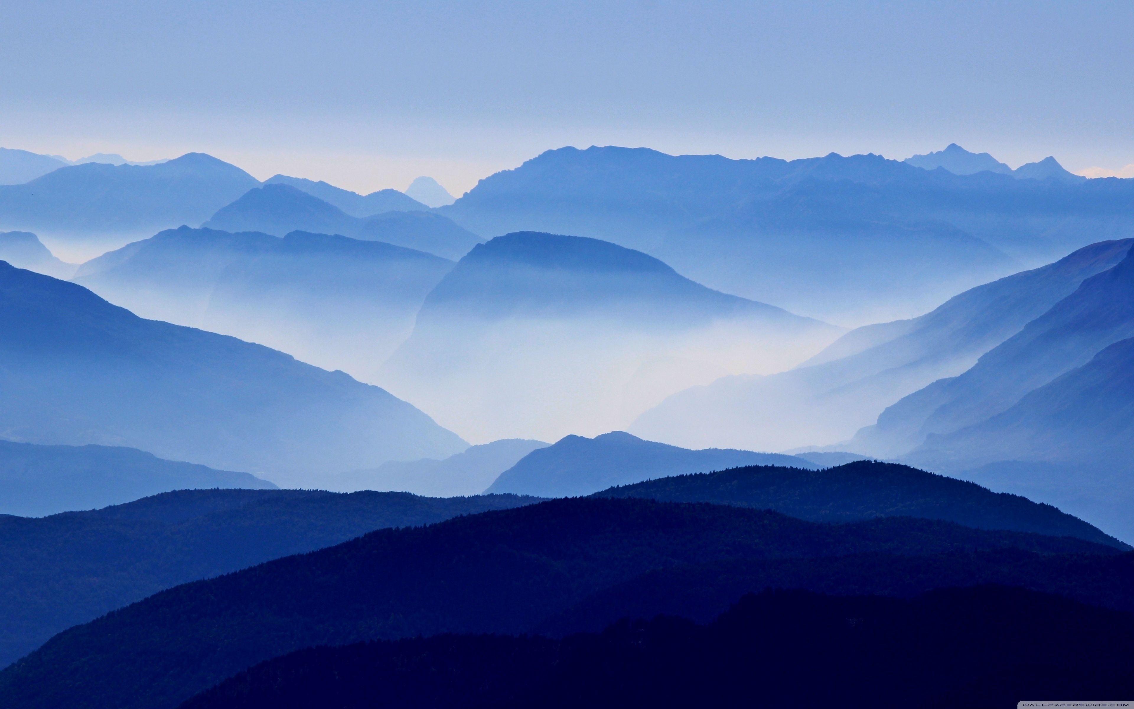 A view of mountains with fog in the background - Mountain