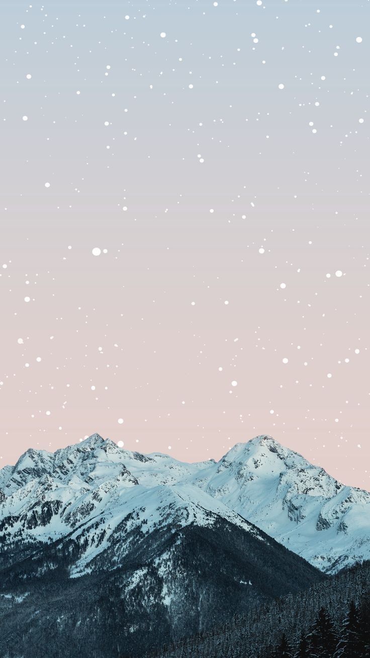 A snowy mountain range with a pink and blue sky - Mountain
