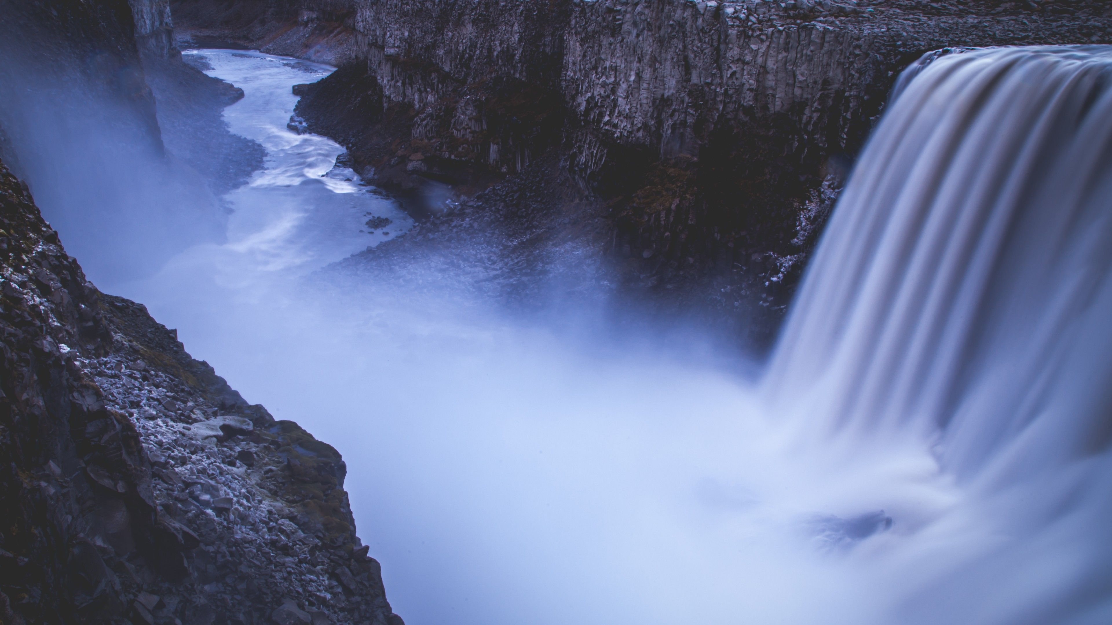 A long exposure photograph of a waterfall with mist - Waterfall