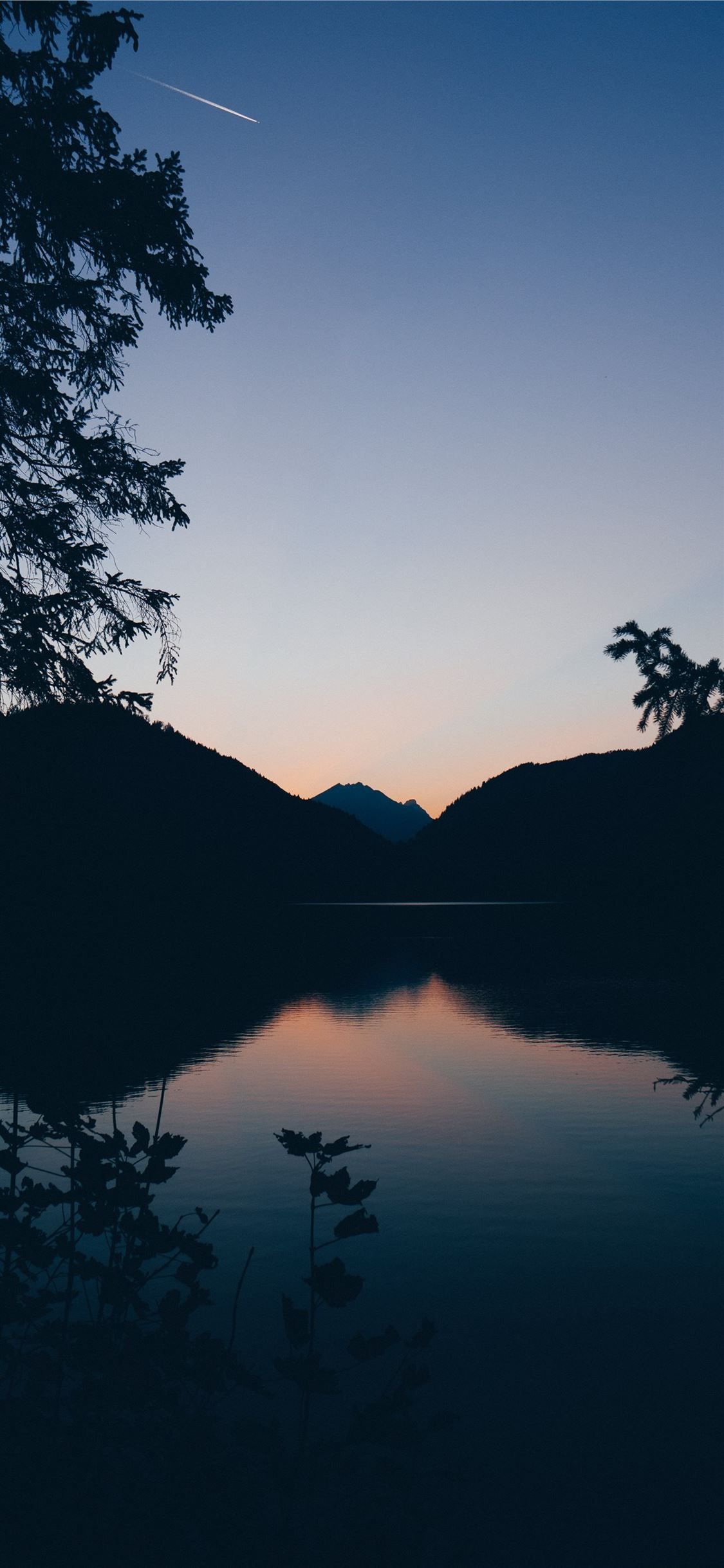 A beautiful shot of a lake and mountains at sunset - Lake