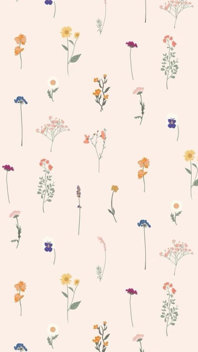 Wallpaper with small flowers in different colors on a light pink background - Pattern