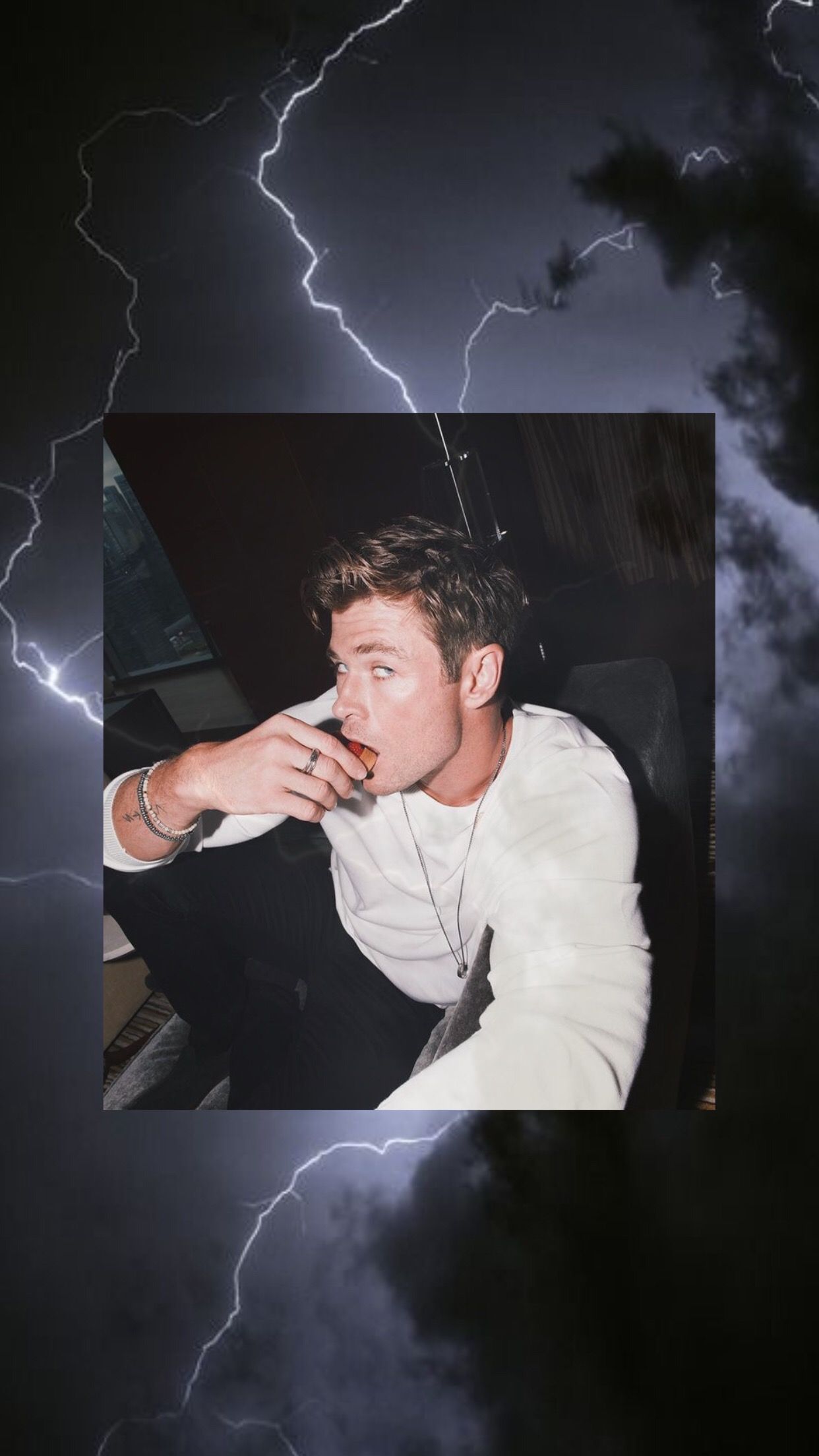 A man smoking in front of storm clouds - Thor