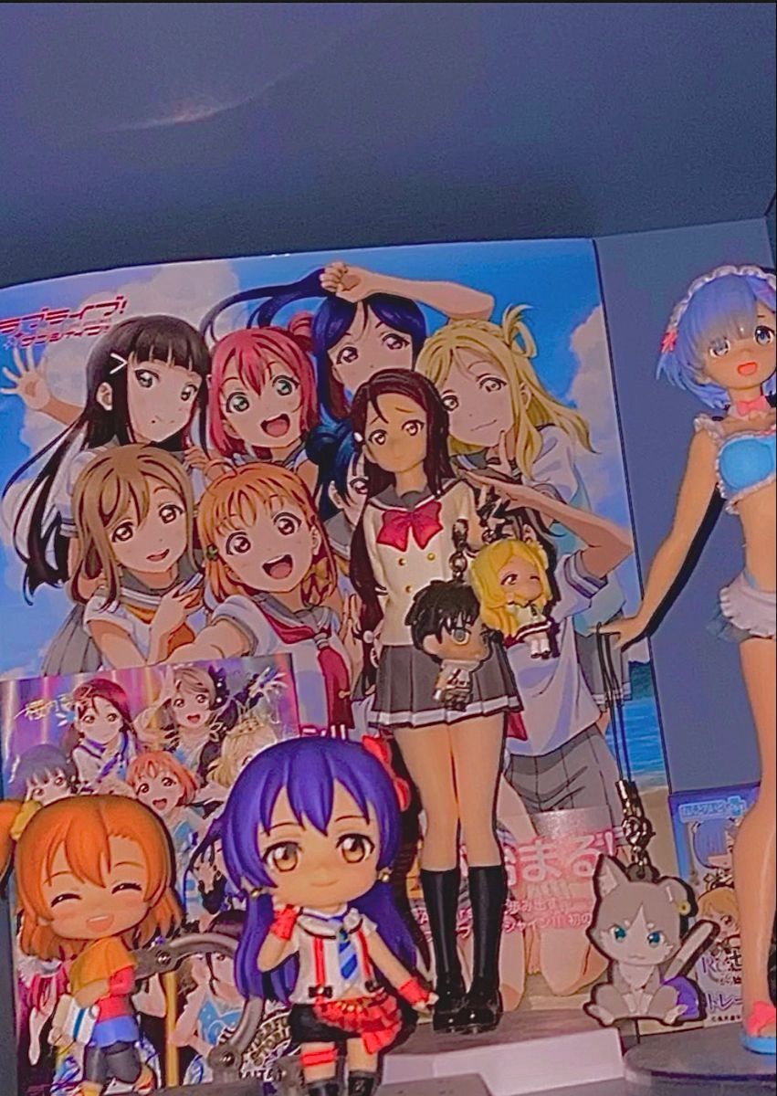 A group of dolls are displayed on the wall - Animecore