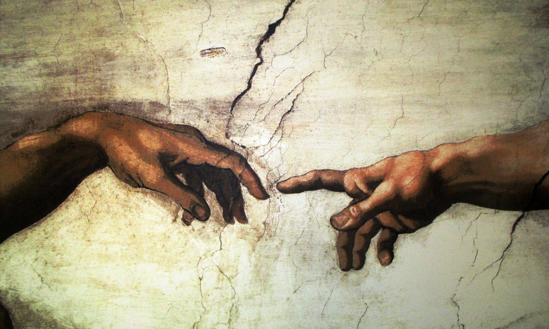 A painting of two hands reaching out - The Creation of Adam