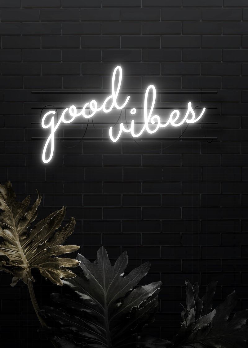 Neon sign that says good vibes - 