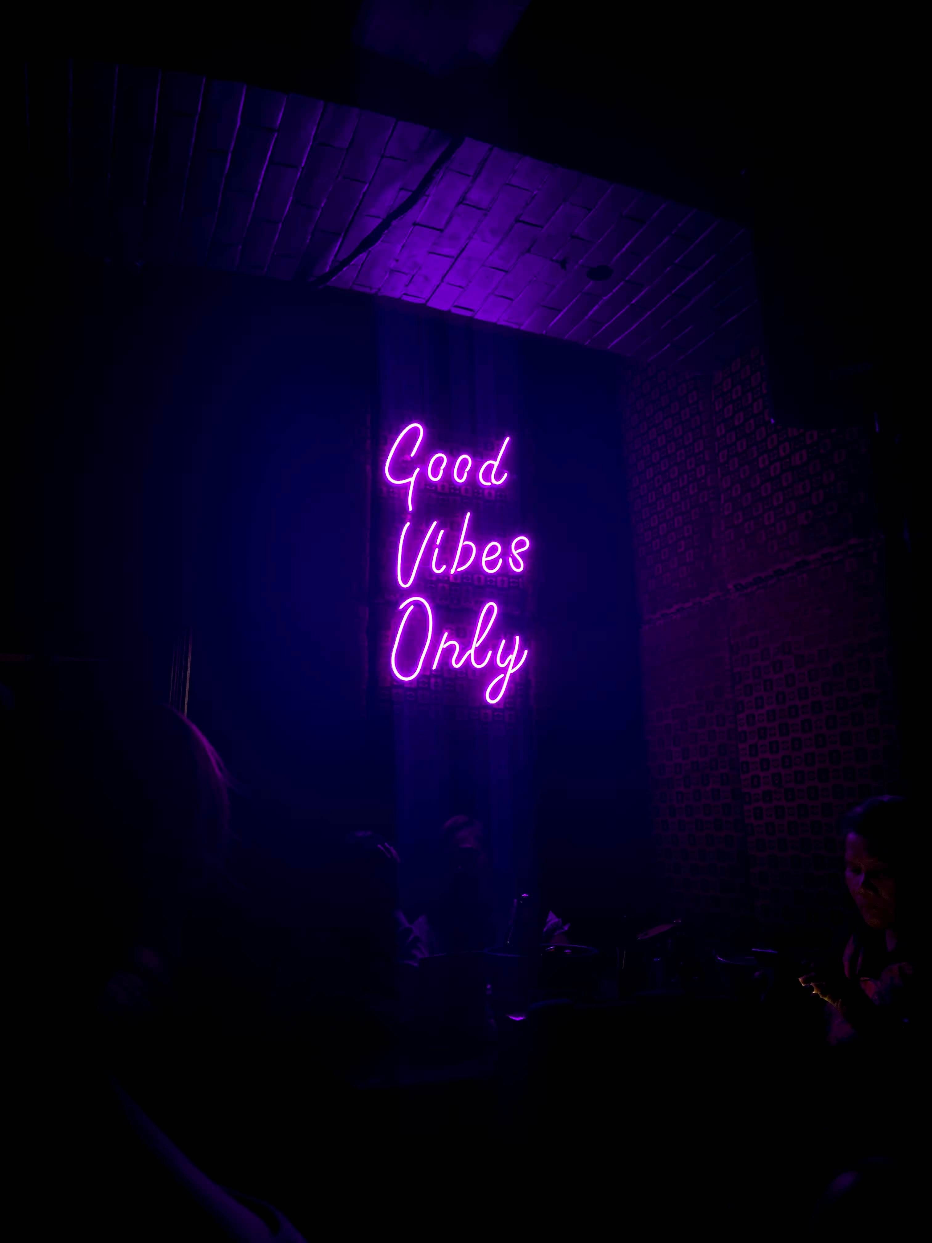 A purple neon sign that reads 