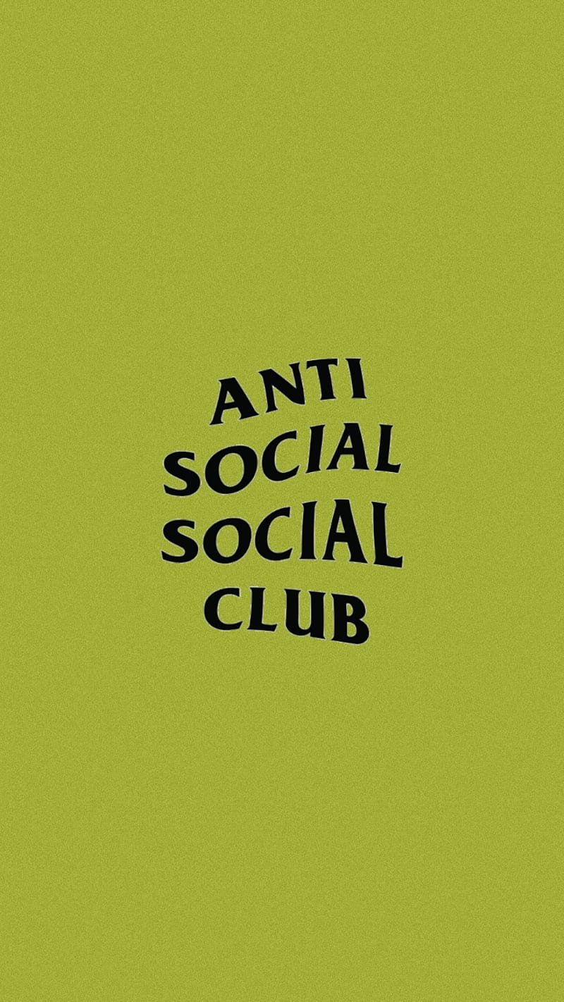 , a sign promoting an anti-social social club appears on a green background. The sign features a large black typeface and is positioned in the center of the image, reading 