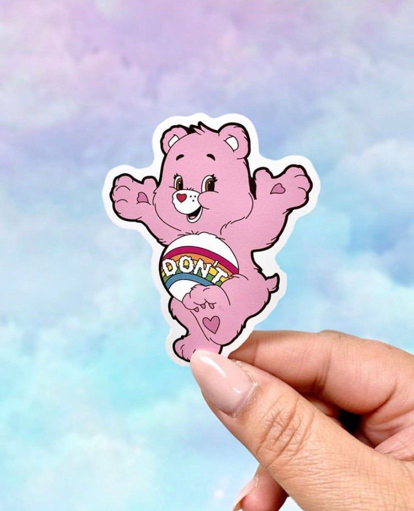 A person holding up an image of care bear - Care Bears, sticker
