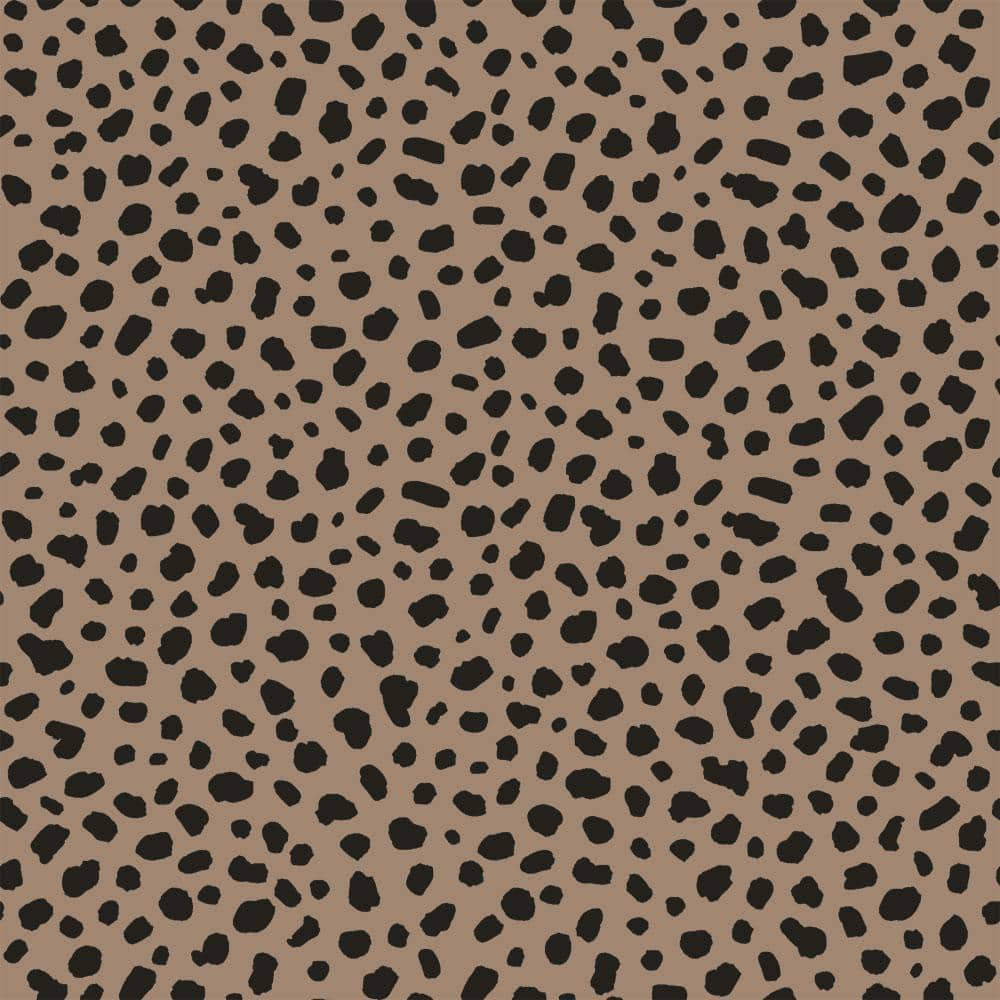 A pattern of black and brown spots on tan background - Leopard